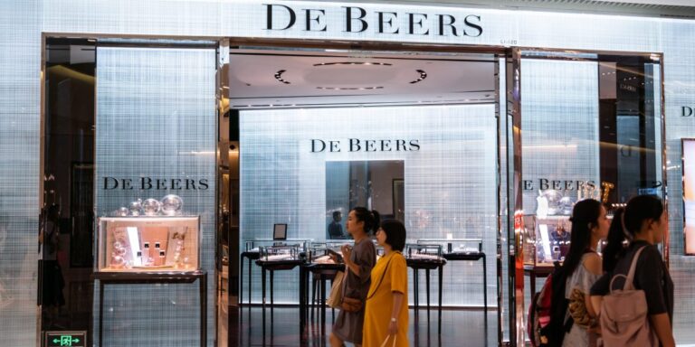 Chinese retailers are offloading polished diamonds as demand tanks, adding to a $2 billion inventory headache for De Beers